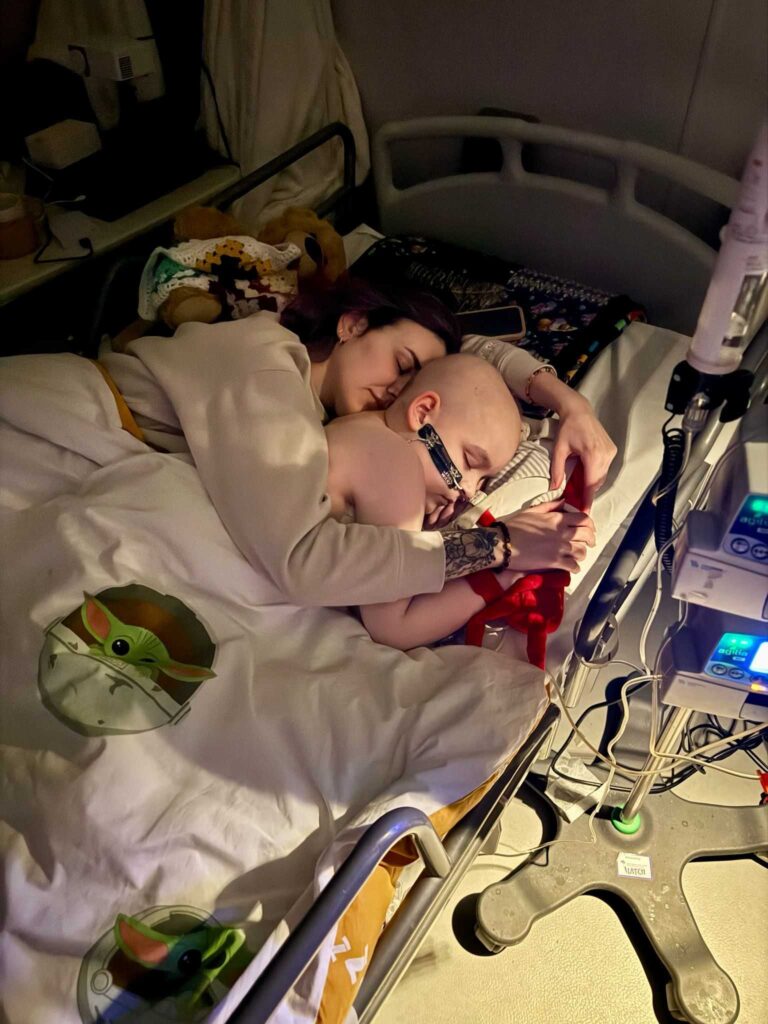 laying in the hospital bed with Oliver
